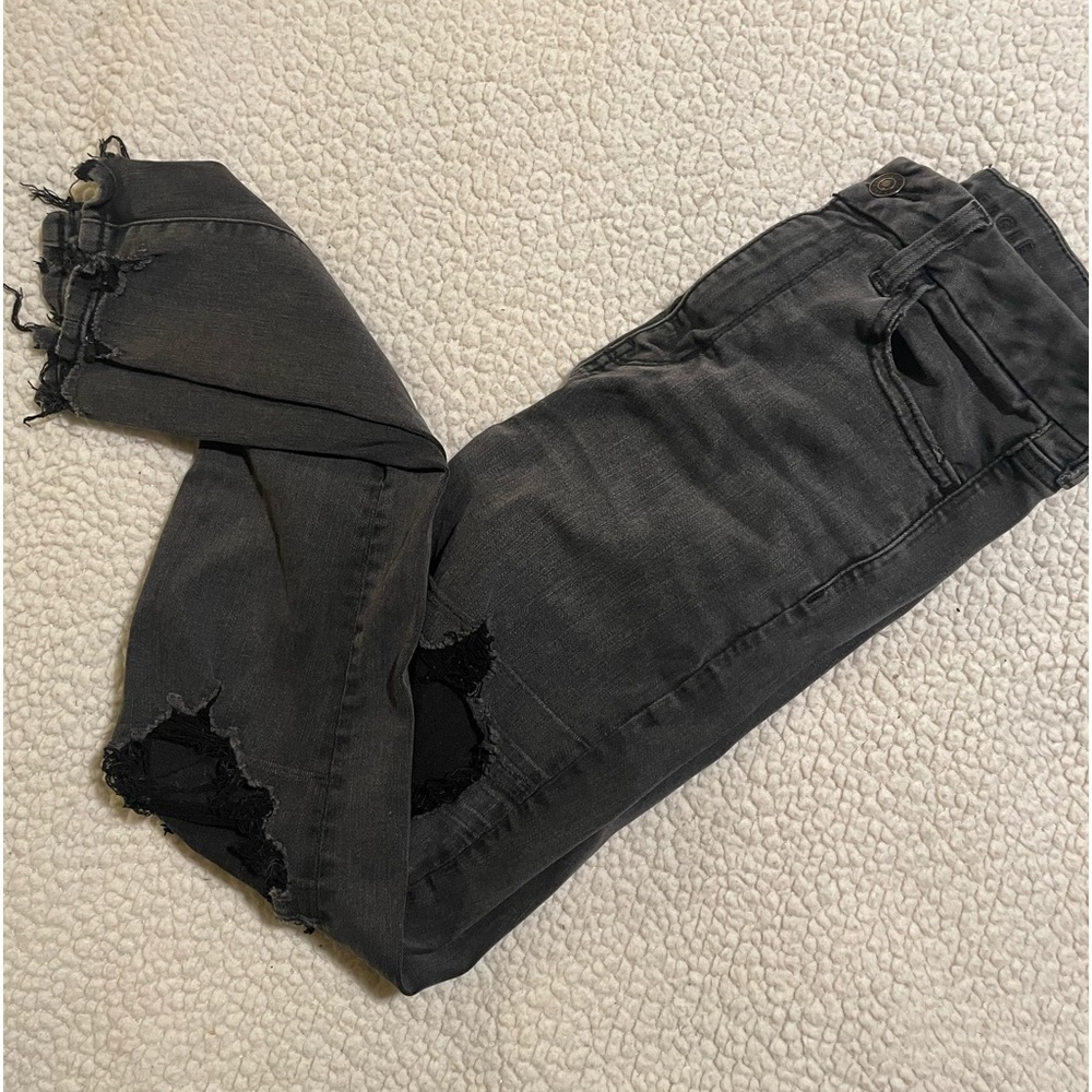 black wash ripped jeans with ripped ankles